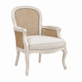Poltrona in legno con schienale in rattan e seduta in lino bianco