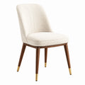 Sedia in tessuto bouclé beige con gambe in legno e dettagli in ottone